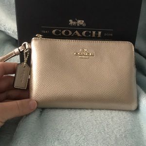 Gold COACH wristlet